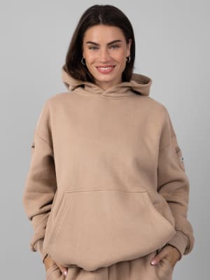 Travel Essentials Hoodie: Lauren is 5’8” and wears a size M