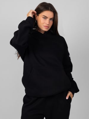 Travel Essentials Hoodie: Lauren is 5’8” and wears a size M