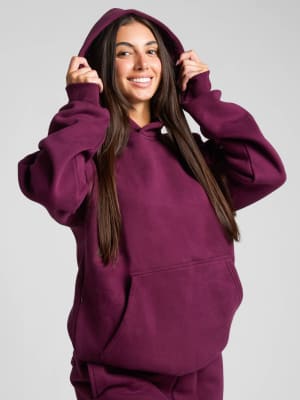 Travel Essentials Hoodie: Sara is 5'6" and wears a size M