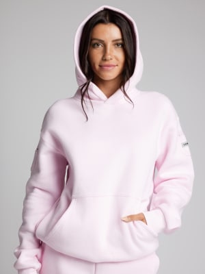 Travel Essentials Hoodie: Abby is 5′9″ wearing a size M