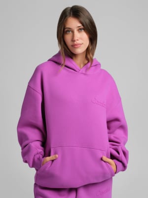 Minimalist Hoodie: Nikki is 5'8” and wears a size S