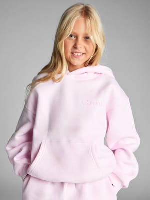 Minimalist Kids Hoodie: Arina is 9 wearing a size S